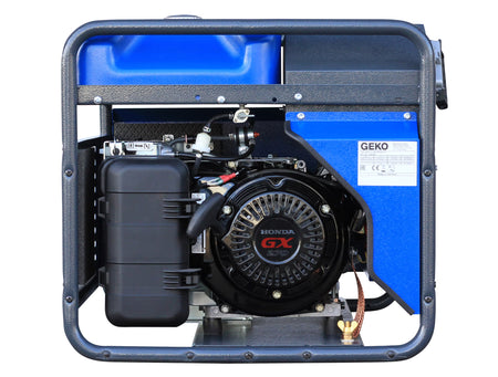 Side view of a blue generator displaying a Honda GX270 engine on white background 