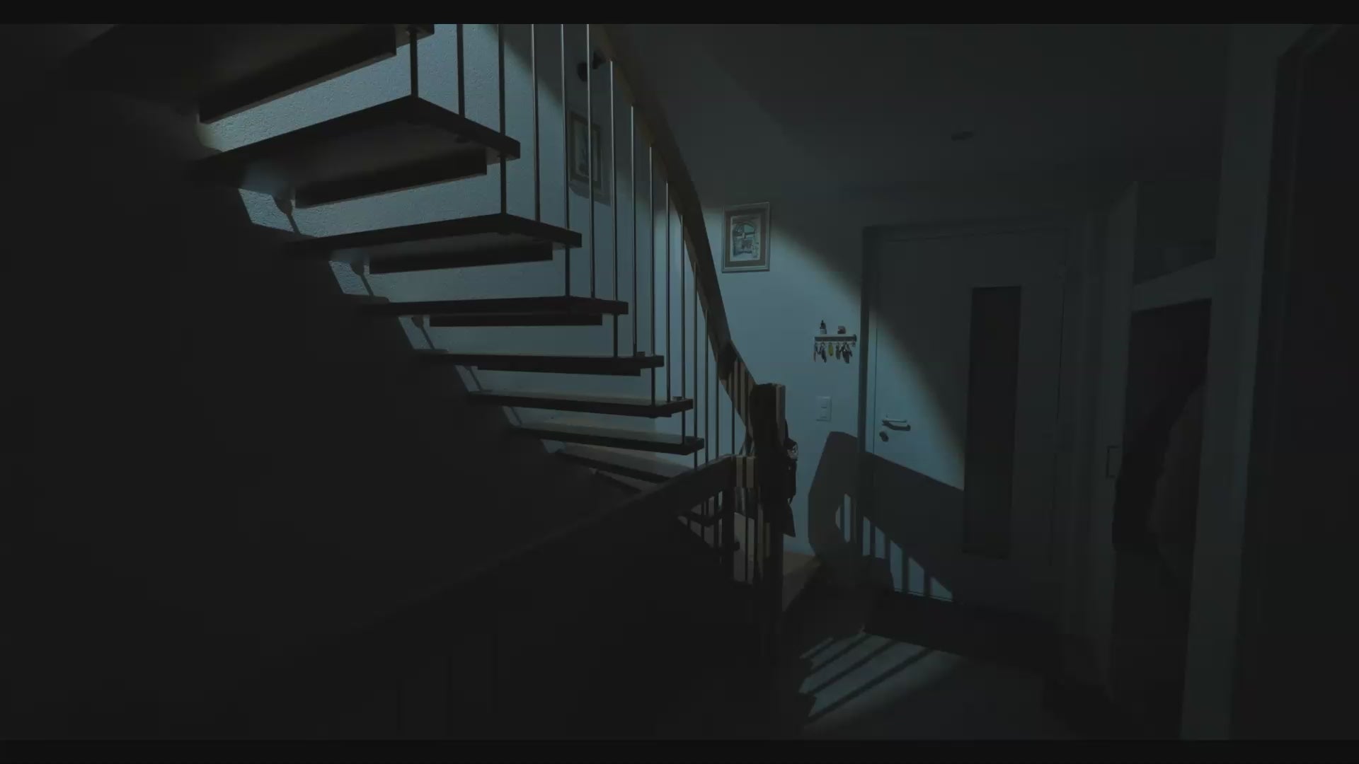Video of a man going down his apartment staircase with a hand torch during a blackout 